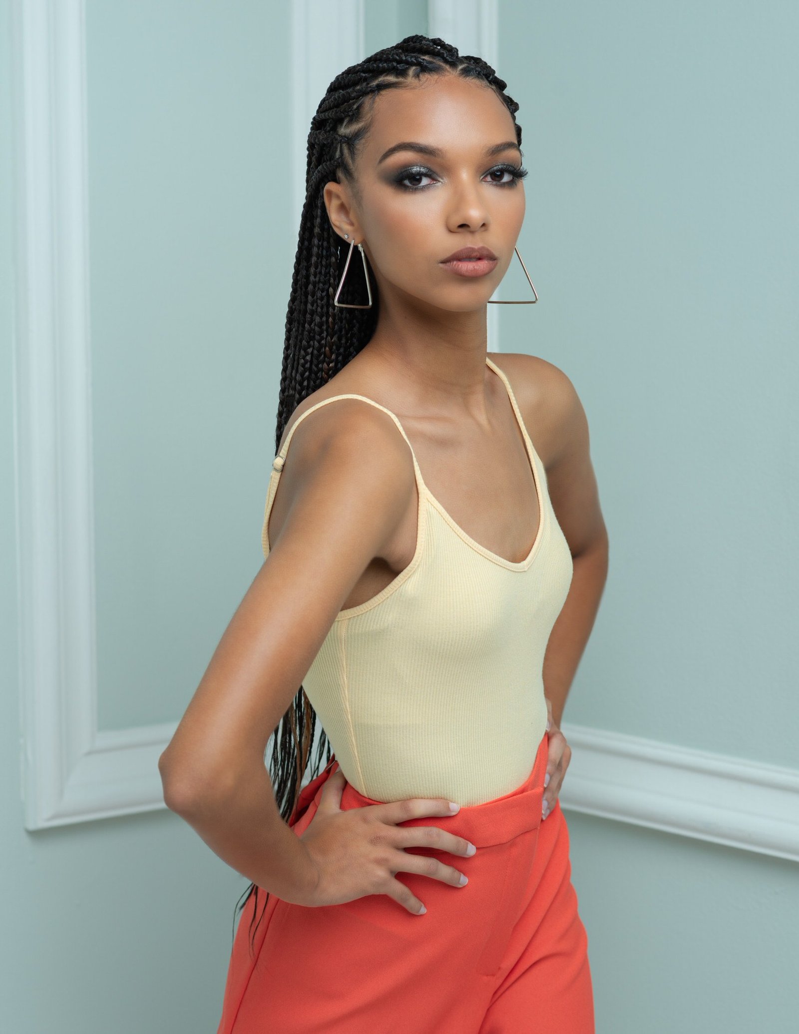 Artistic Emages Professional woman posing confidently after branding photography session in Dallas, styled in bold colors for high-impact visual authority.