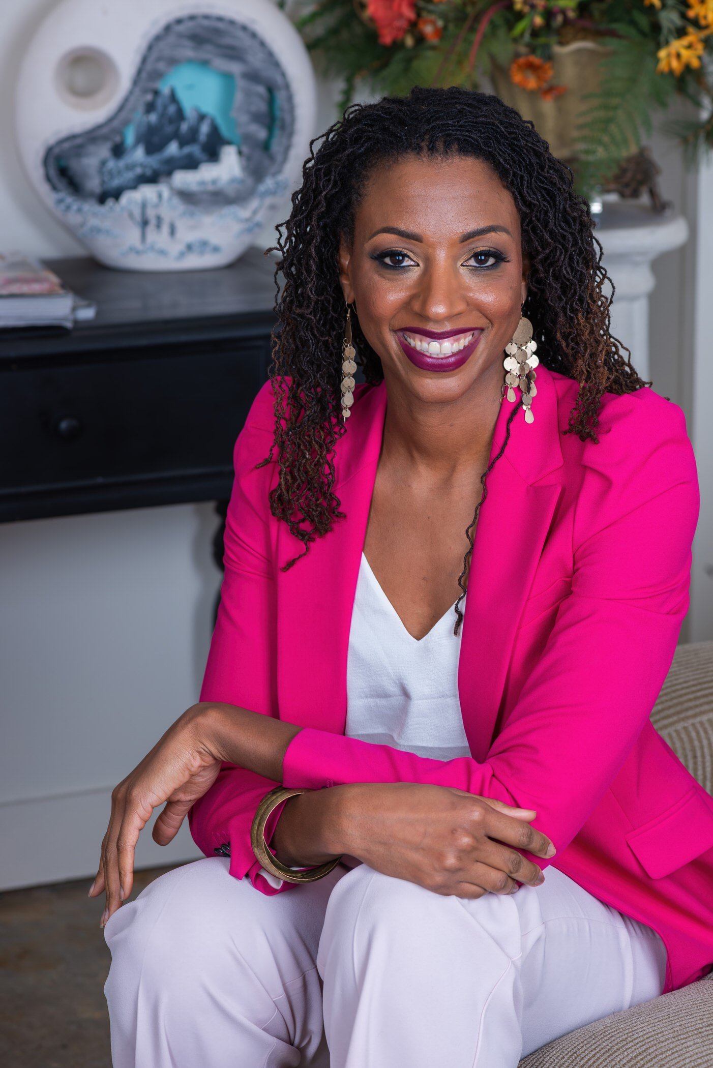 Artistic Emages Confident professional woman in a bright pink blazer, representing empowered leadership for luxury branding photography in Dallas