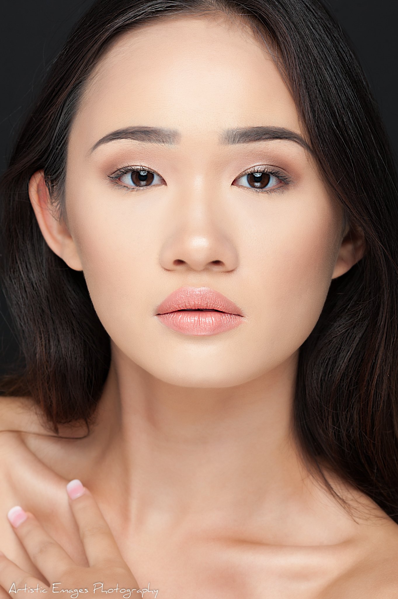 (c)Artistic Emages Photography High end branding photographer Dallas close-up portrait of a poised woman with flawless makeup, styled for modern authority and elegance.