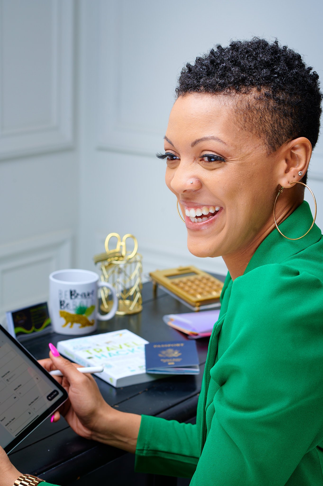luxury-branding-photography-for-whitney-executive-headshot Smiling professional woman in green blazer during a personal branding photoshoot in Dallas at a styled modern office setting