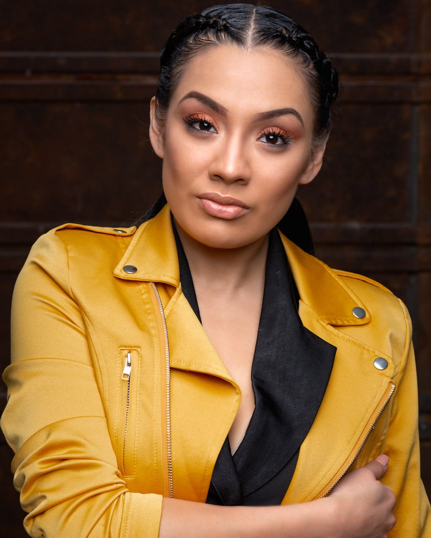 Artistic Emages luxury branding photo of woman in yellow jacket with confident pose