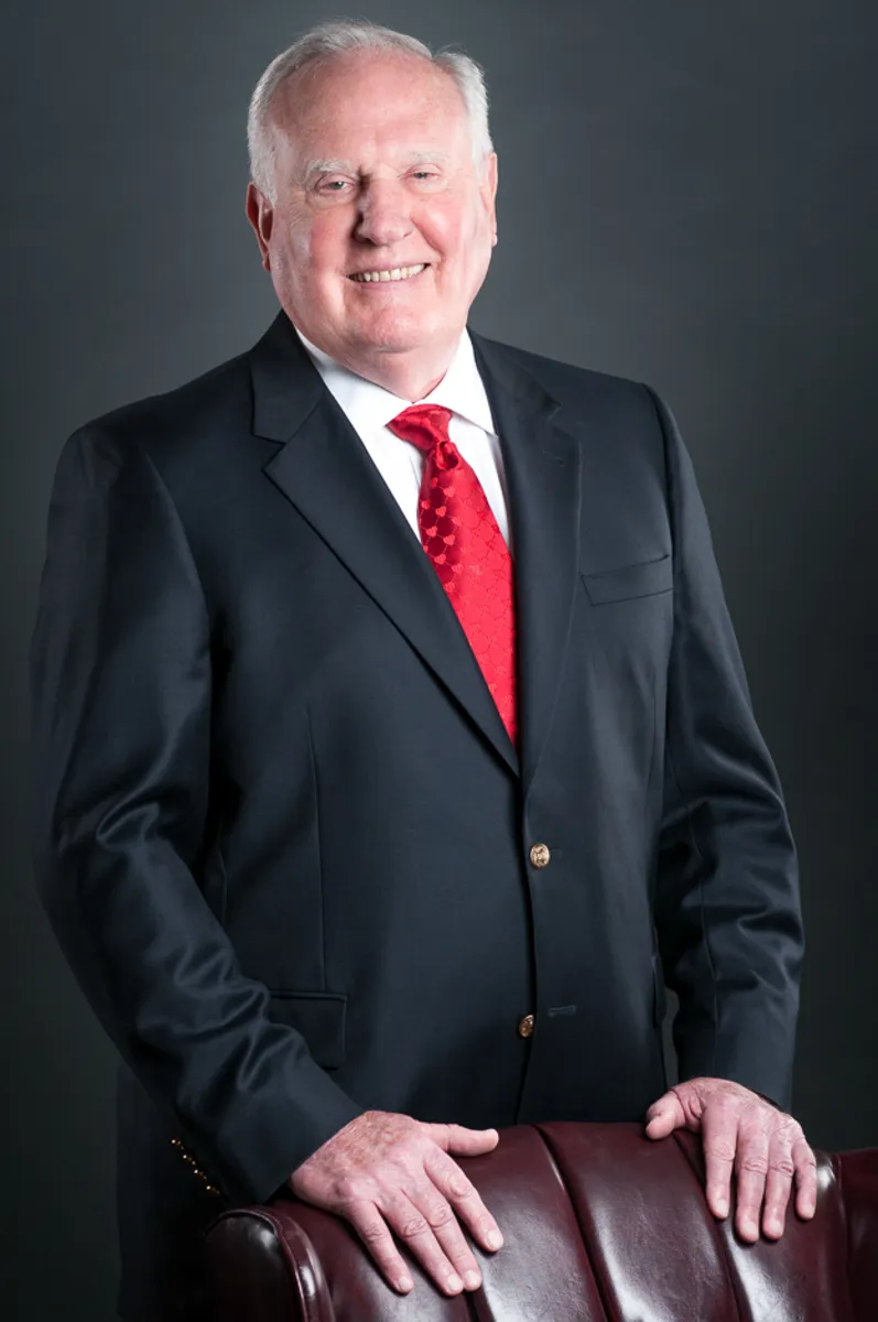 executive-branding-photography-environmental-authority-01 Senior executive corporate headshot red tie leadership portrait