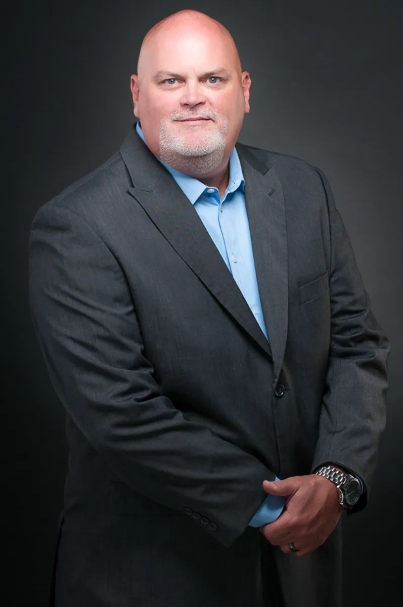 On-location executive branding photography example featuring a professional leader in a real-world business environment