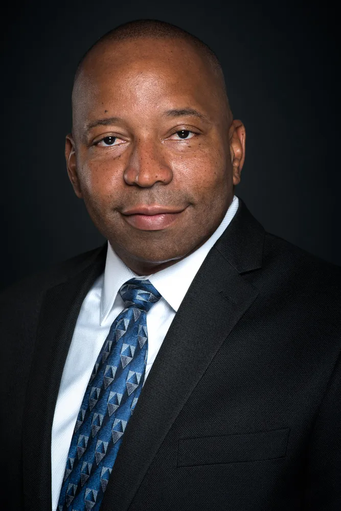 Dallas executive headshot Black business leader professional portrait black suit